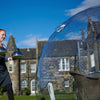 Outdoor Dining dome with waitress and hotel in the background