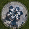 Top down view of a 3.6m dining dome, set for breakfast in the sun.