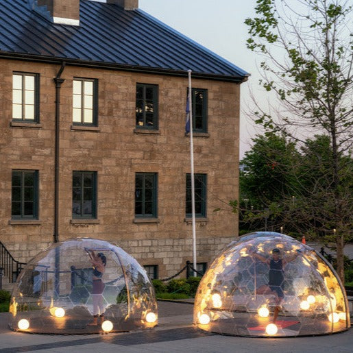 Yoga in an Aura Dome with globe lights