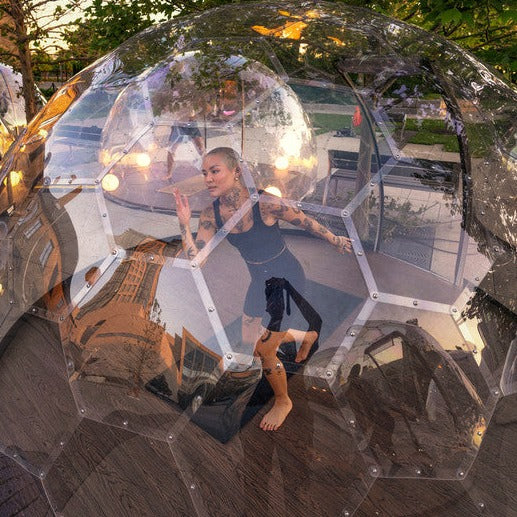 Yoga in an outdoor Aura Dome with wooden floor