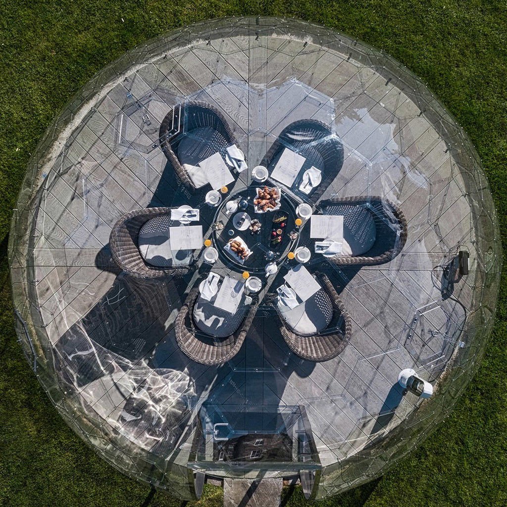 Top down view of a 3.6m outdoor garden dome set for breakfast