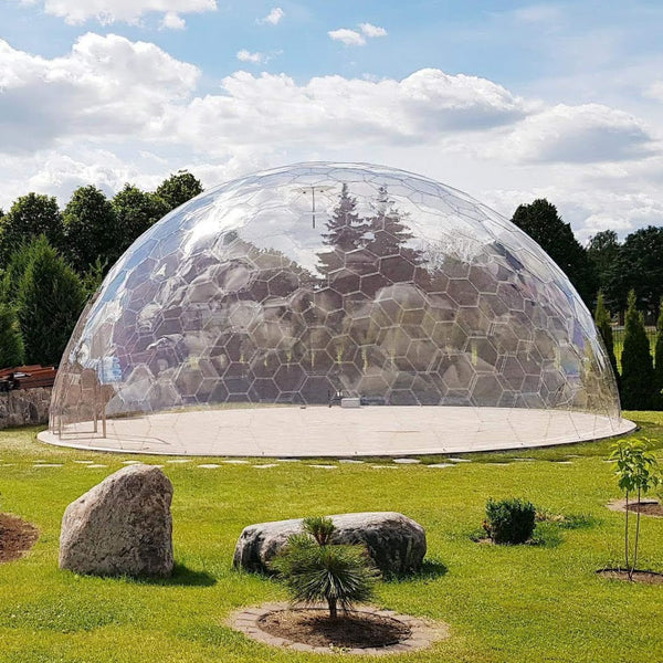 10m outdoor Perspex  dome built in a back garden surrounded by trees 